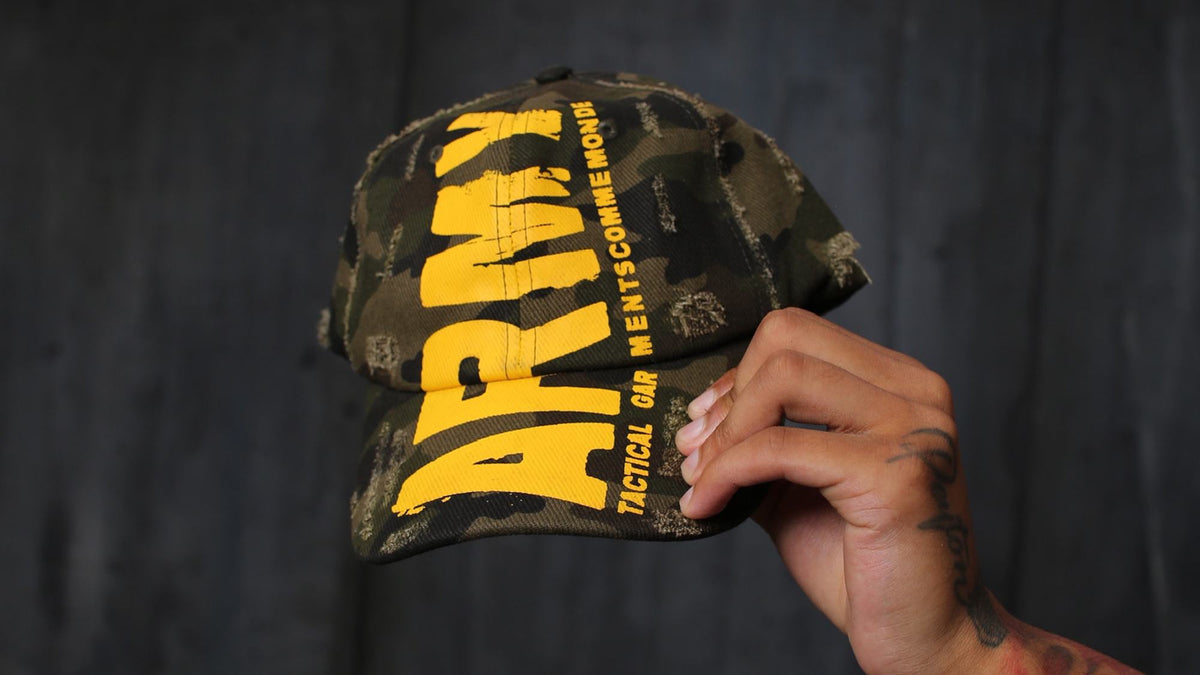 Gouge Worldwide ARMY camo cap held up